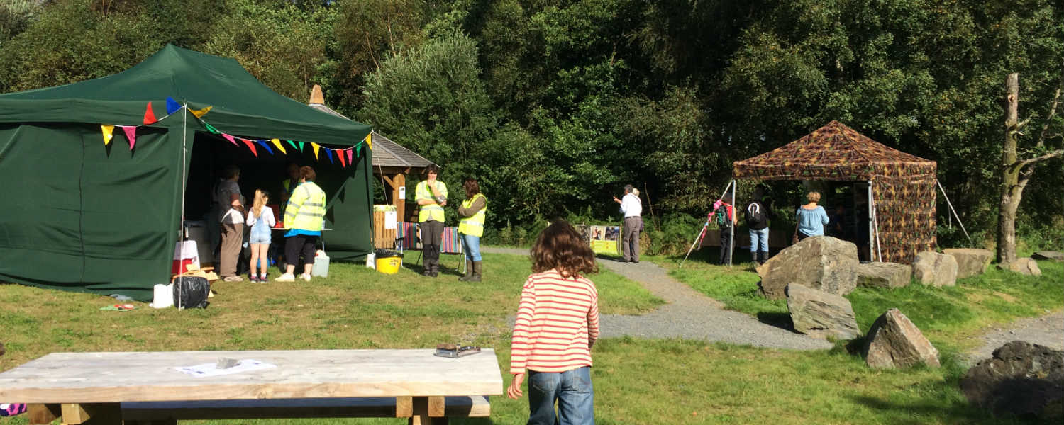 tent stalls set up in a local community field for an event