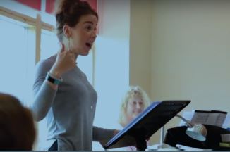 Community Leadership Academy Student Caryl Griffiths giving a speech